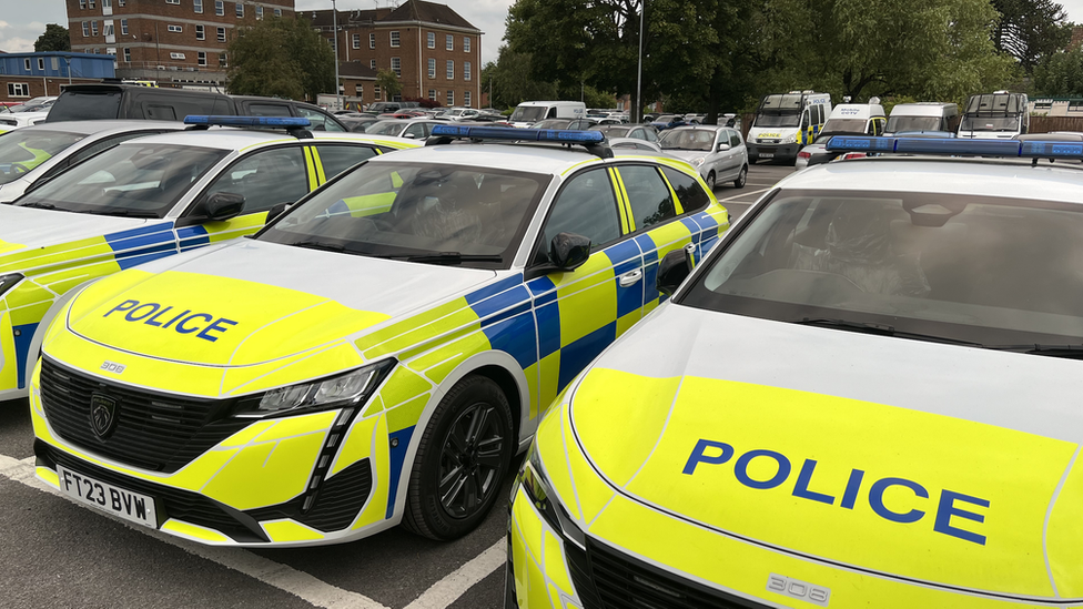 Wiltshire Police cars parked outside its headquarters