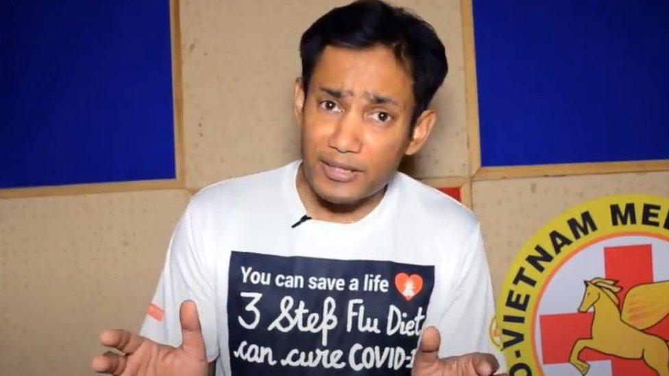 Mr Chowdhury wearing a t-shirt that says his diet can cure Covid-19