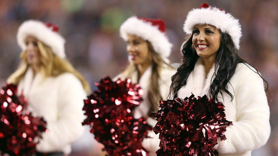 NFL cheerleaders in Christmas costumes