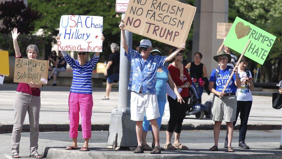 Protesters rally outside the Hawaii State Capitol on Monday Dec. 19,2016, in Honolulu