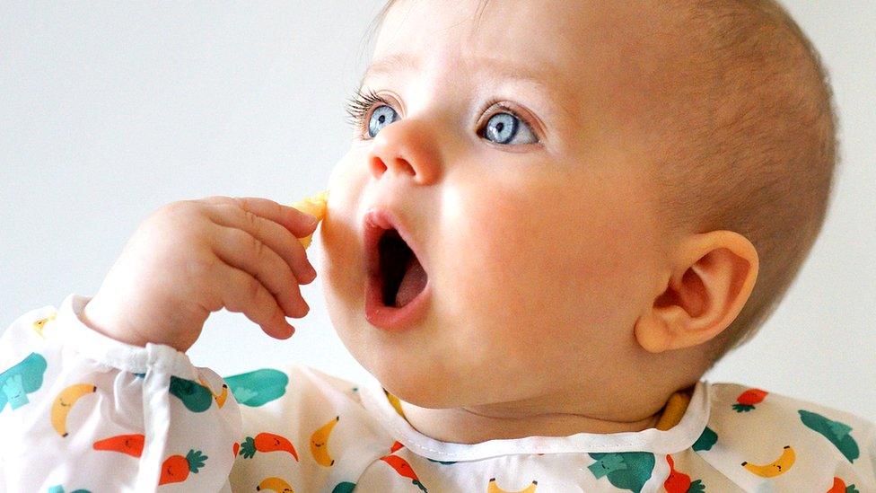 Baby eating a snack