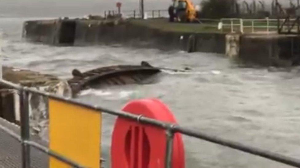 Picture of a section of the lock gates at Milford Marina floating in the water after they were forced open