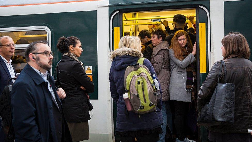 Commuters jammed onto a train