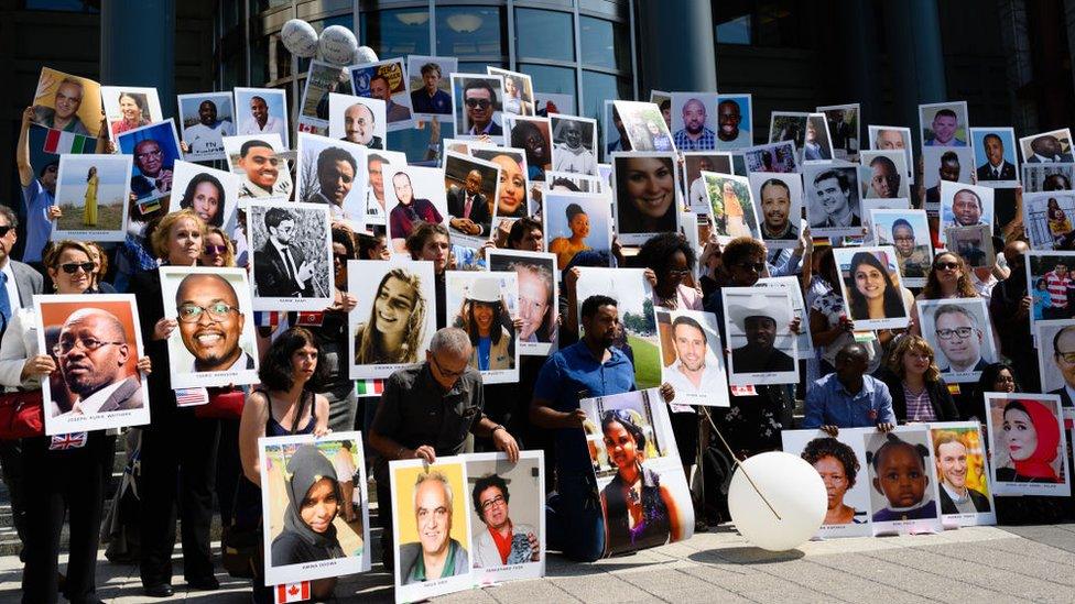 The families of the victims of the Ethiopian Airlines crash holding a vigil in front of the US Department of Transportation headquarters in Washington, DC in September 2019