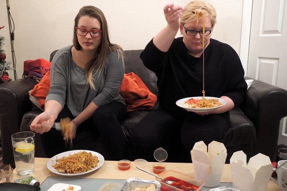 Anna Maria and her flatmate Zelda eat dinner