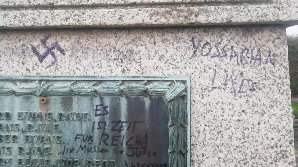 A swastika on the war memorial