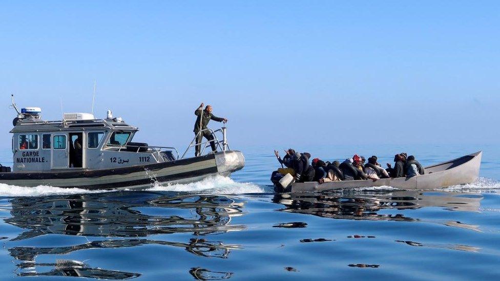 Tunisian coast guards try to stop migrants at sea during their attempt to cross to Italy, off the coast off Sfax, Tunisia April 27, 2023