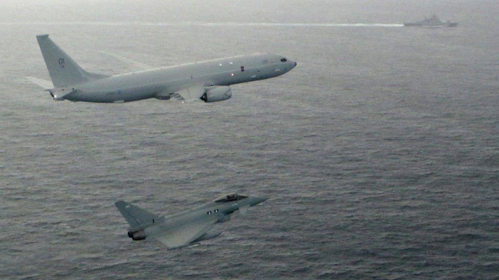 The Poseidon, top, and a Typhoon with warship, top right