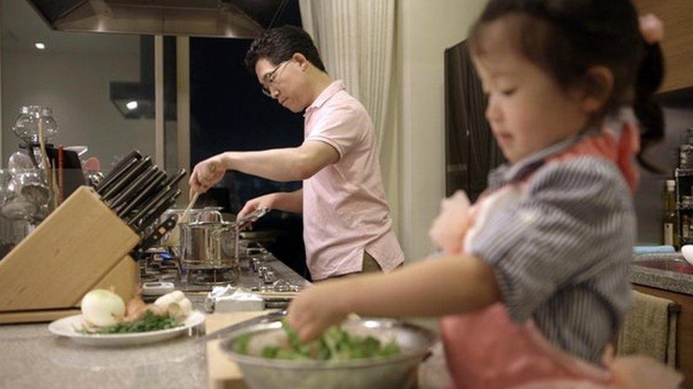 Cooking with his daughter