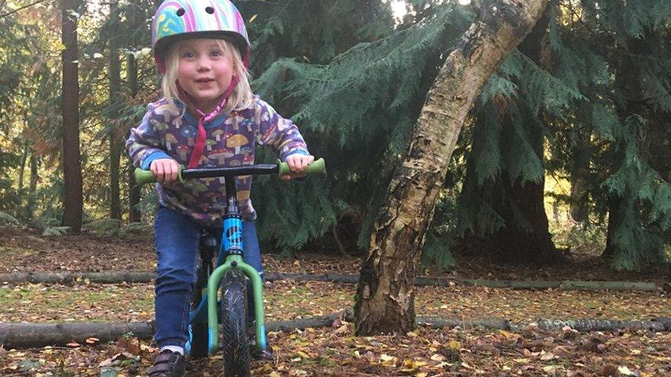 Ayla riding a bike