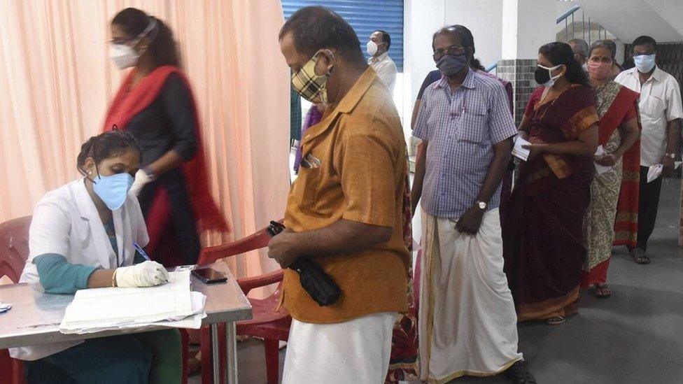 People queue up at a Covid-19 vaccination centre in Kochi on Wednesday