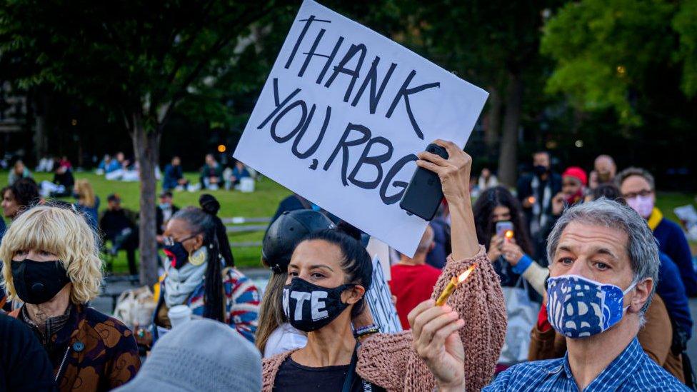 Lady holding up a thank you, RBG sign