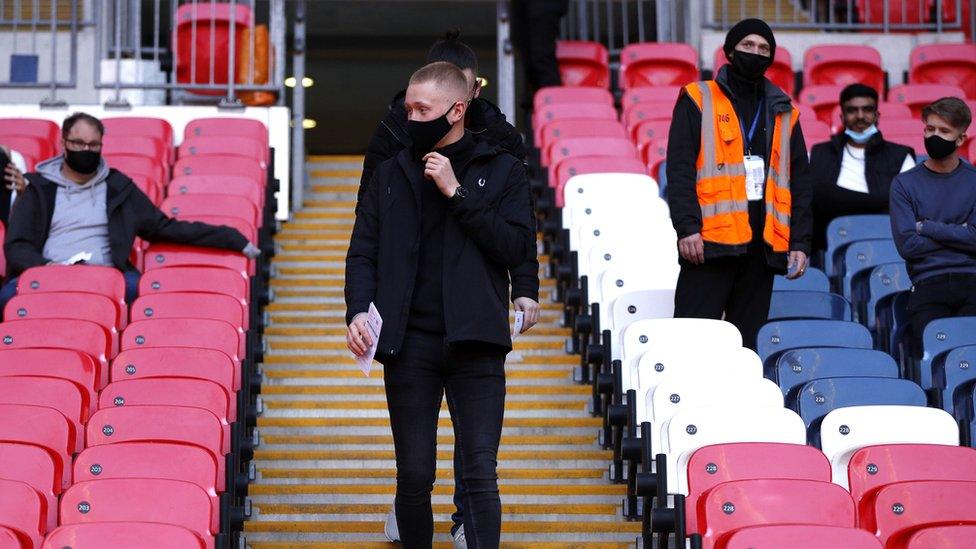 Fans arrive in stadium