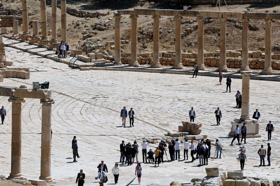 Prince William and Crown Prince Hussein walk at the ancient city of Jerash