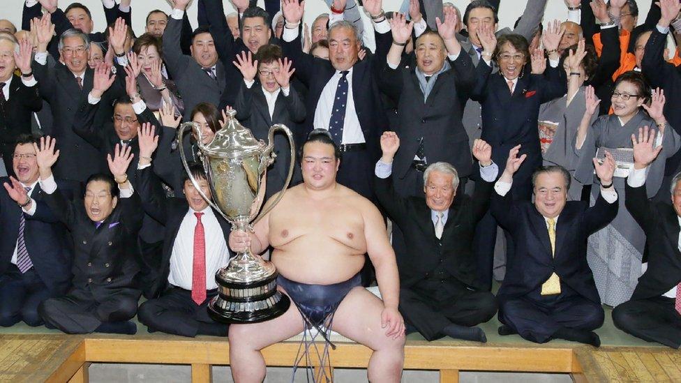 Kisenosato with the Emperor's Cup trophy