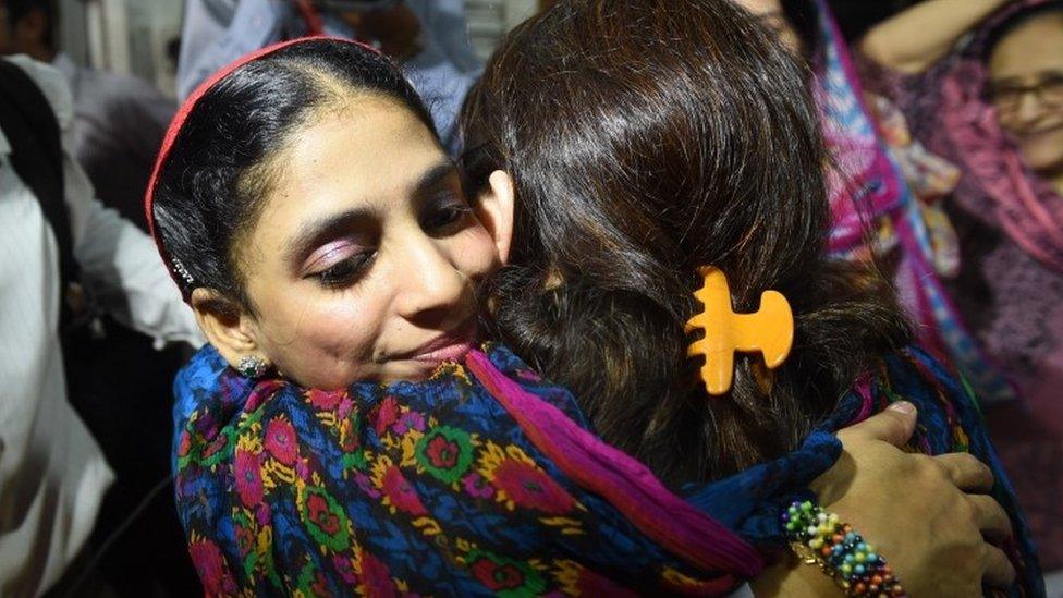 Deaf-mute Indian woman Geeta meets with friends before leaving for the airport from the EDHI Foundation in Karachi on October 26, 2015.