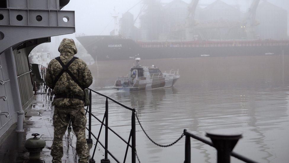 A Ukrainian soldier mans the machine-gun of a vessel on the Azov Sea on November 28, 2018 in Mariupol, Ukraine