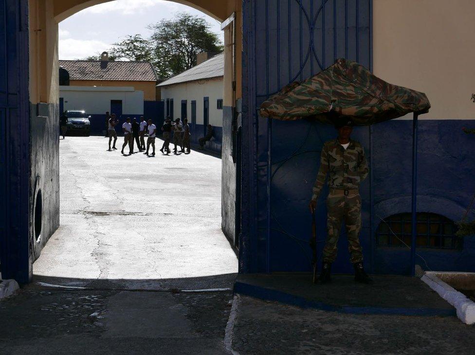 Soldier standing guard outside the main army garrison in Praia.