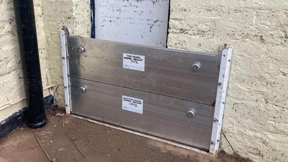 flood gates in the door way of the Haw Bridge Inn