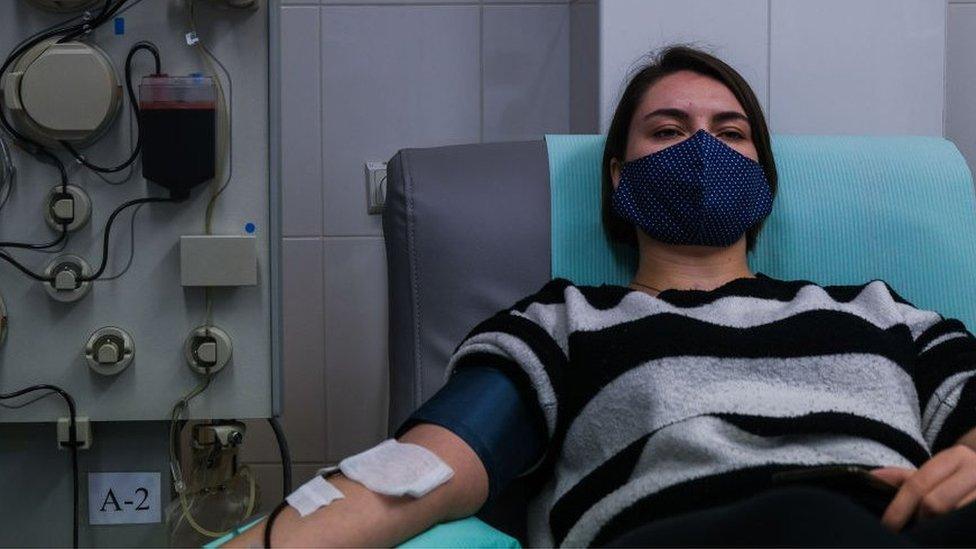 Kristina, (21years old) who recovered from COVID -19 donates her plasma via plasmapheresis method at the Regional Center of Blood Donation and Blood Treatment on November 10, 2020 in Krakow, Poland.