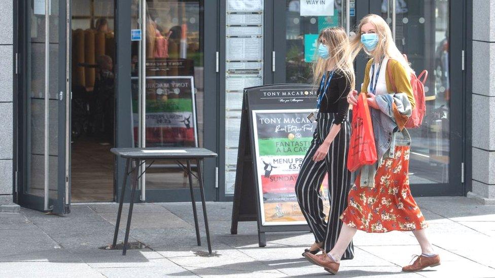 Residents walk in central in Aberdeen