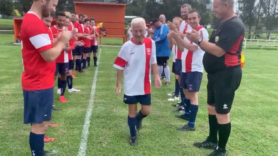 Paul walking through a team guard of honour at the Paul Webster Cup in February