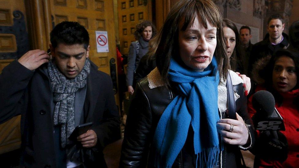 Actress Lucy DeCoutere, a complainant in the case against former Canadian radio host Jian Ghomeshi, leaves the court after an Ontario judge found him not guilty on four sexual assault charges and one count of choking, in Toronto, March 24, 2016