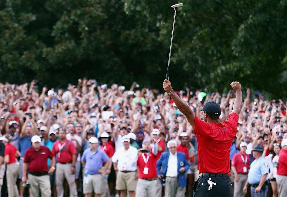 Tiger Woods celebrates winning at East Lake Golf Club , Atlanta