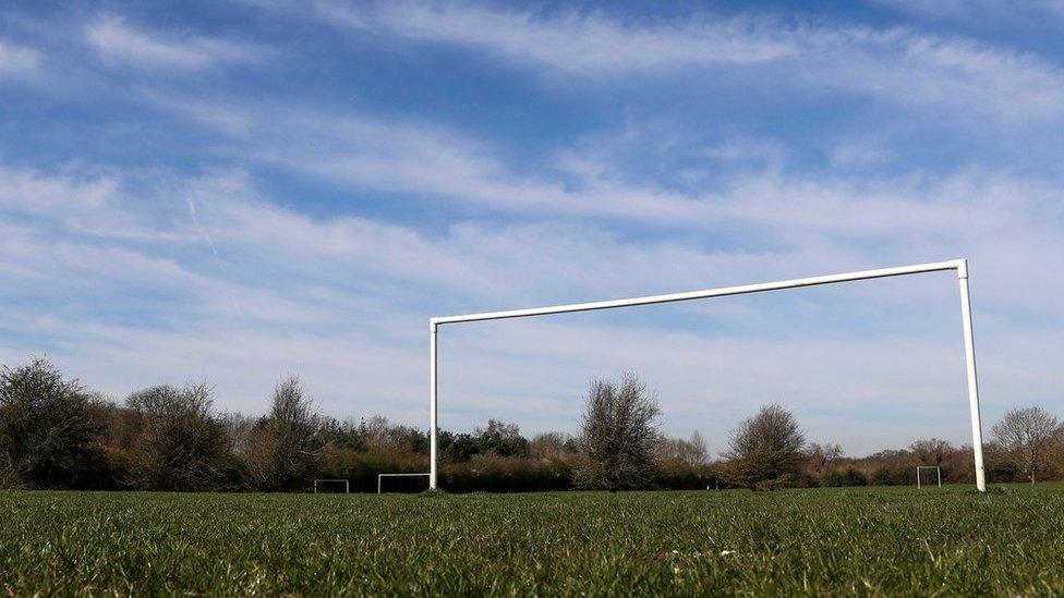 A general view of a field with football goalposts