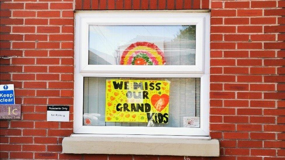 'We miss our grandkids' sign Liverpool