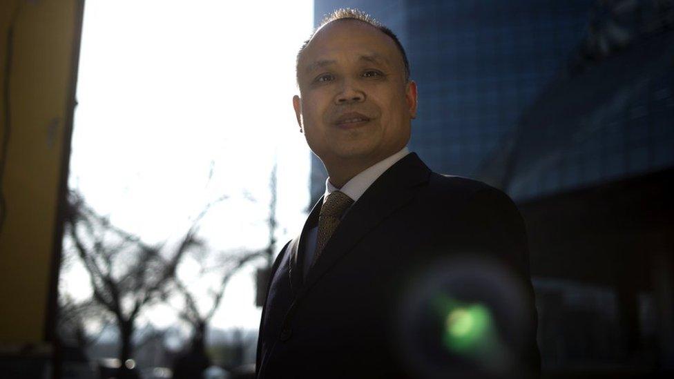 Chinese lawyer Yu Wensheng poses for a portrait in Beijing on January 12, 2017. Toxic smog has found itself in the dock in China, as the authorities are taken to court over a problem that has choked entire regions, put public health at risk and forced the closure of schools and roads.