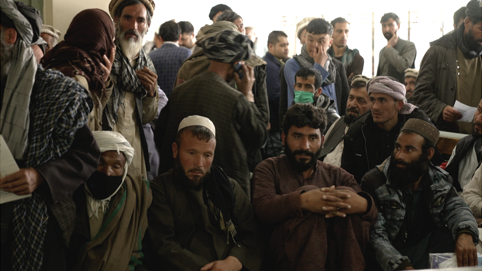 Crowds gather outside the cancer ward in Kabul