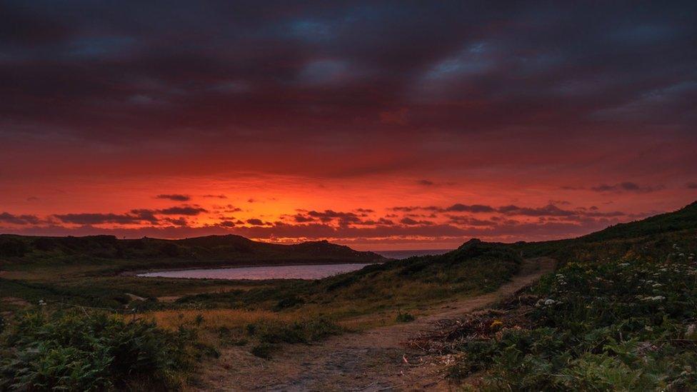 Deep orange sunset in the distance