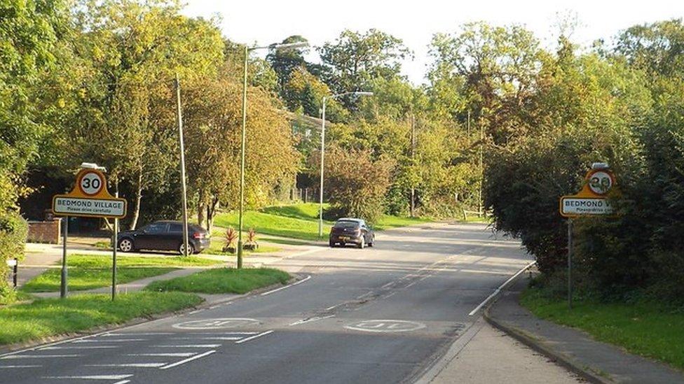 The Bedmond village signs either side of the street as the road enters Bedmond