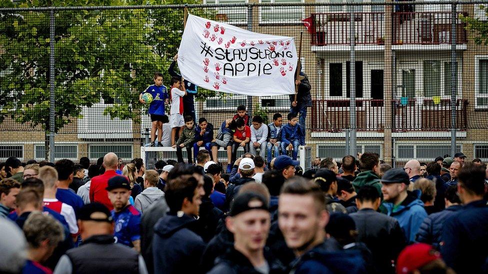 Supporters gather in front of the house of Abdelhak Nouri in Amsterdam, 14 July 2017