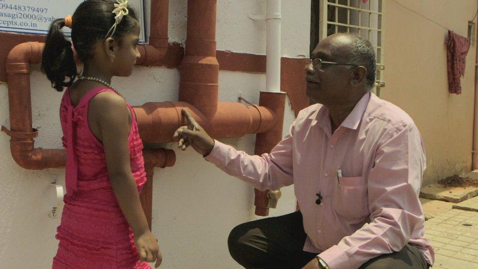 Ayyappa Masagi with young girl