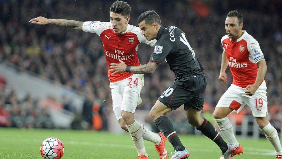 Liverpool's Phillippe Coutinho vies for the ball with Arsenals Hector Bellerin