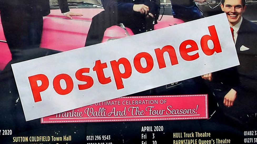 Theatre sign saying "postponed"