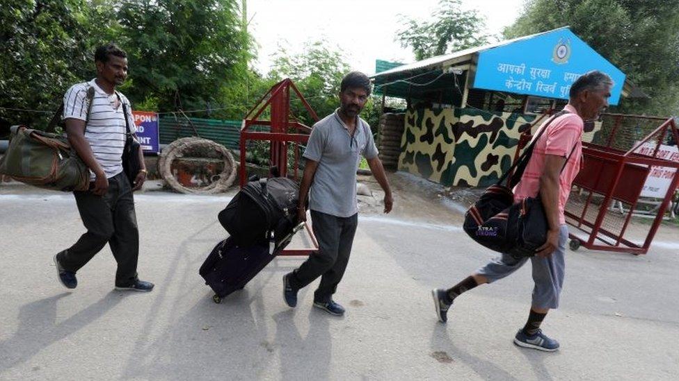 Tourists leave from Amarnath base camp after the pilgrimage was suspended