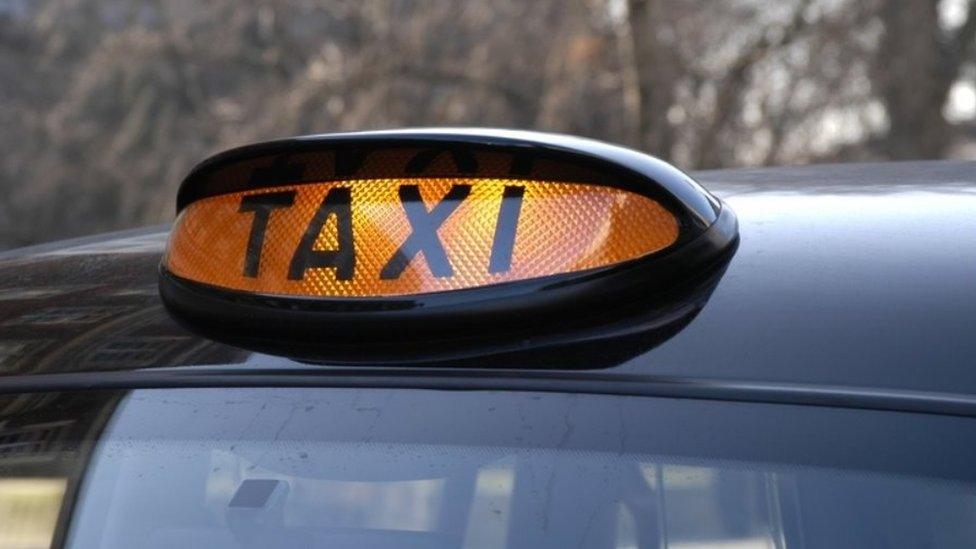 A generic illuminated taxi sign