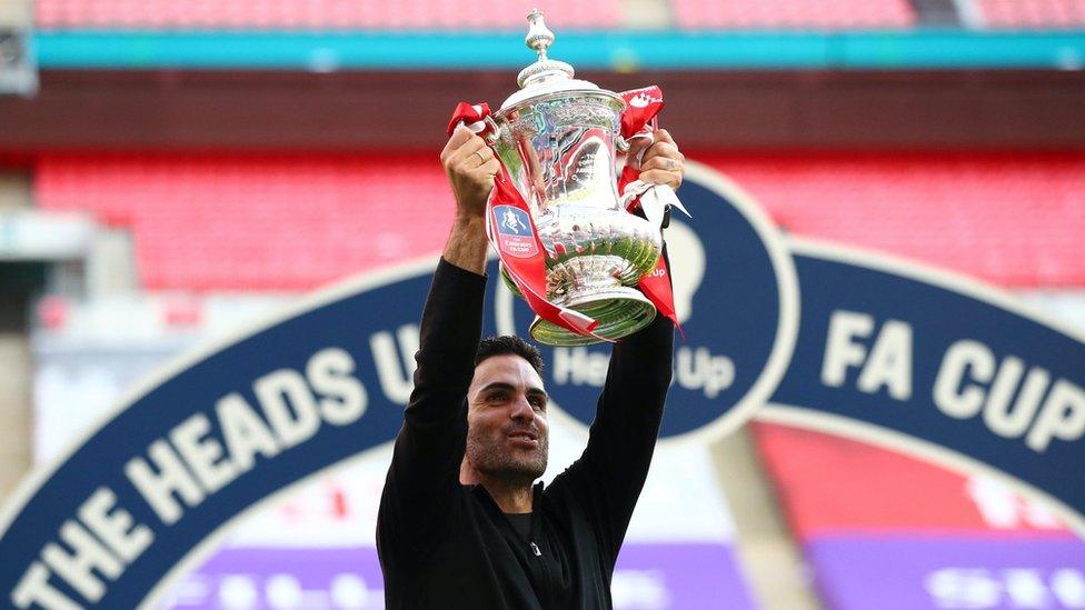 Mikel Arteta, Manager of Arsenal celebrates with the Heads Up Emirates FA Cup Trophy