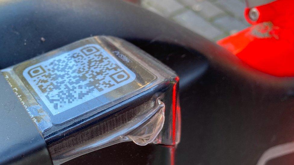 A QR code under a plastic layer