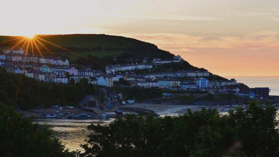 The sun over New Quay in Ceredigion