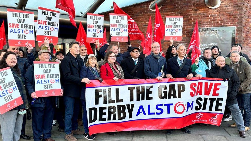 Dignitaries from the council and business community outside Derby railway station