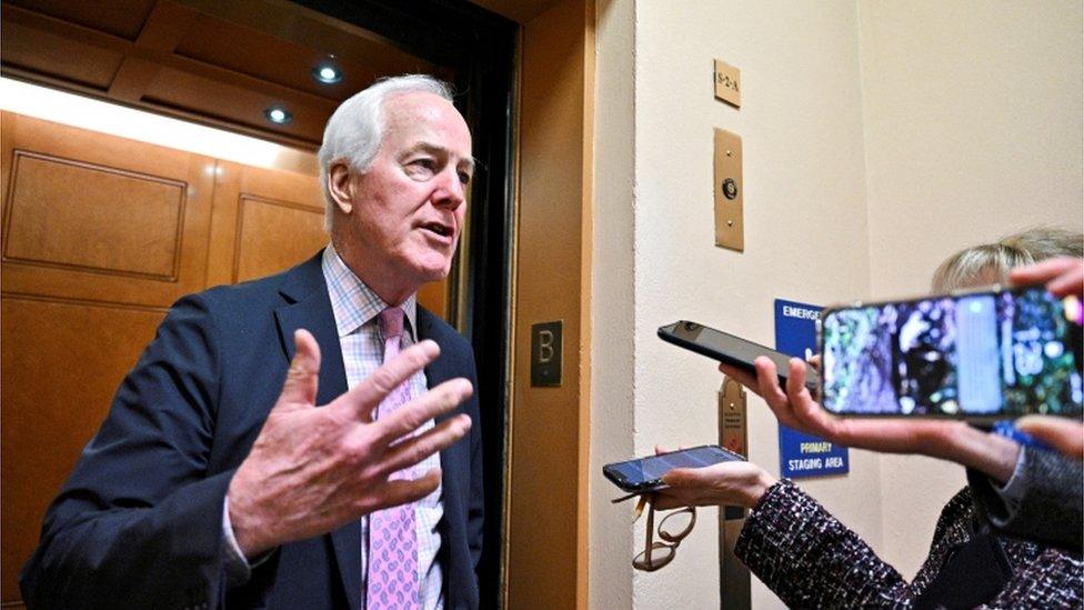 Cornyn talking to reporters (file)