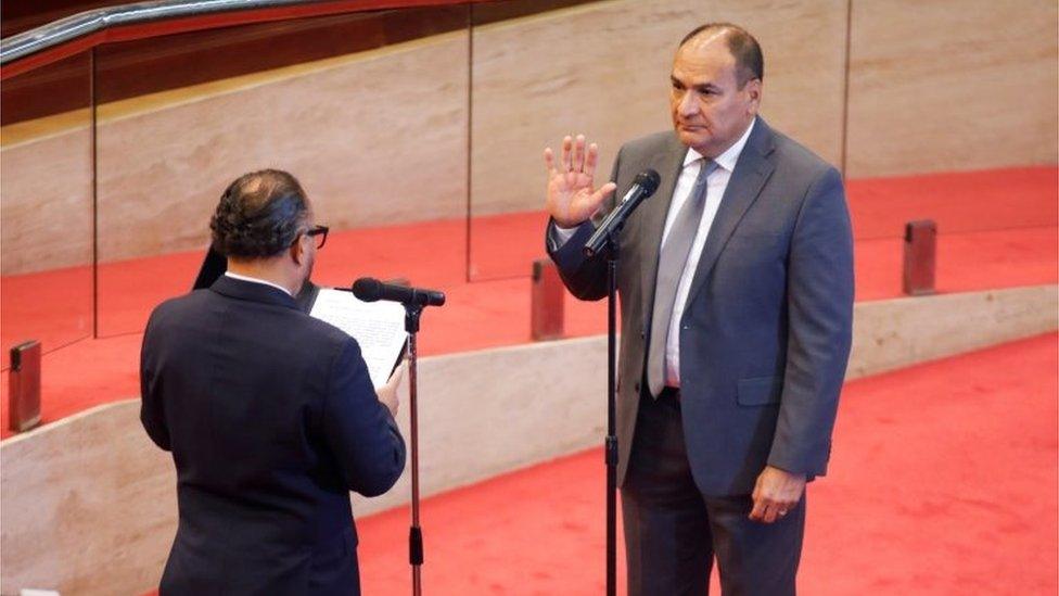 President of El Salvador's Congress, Ernesto Castro, swears in the new president of the Supreme Court, Oscar Lopez Jerez, as the congress removed the Supreme Court judges, at the Salvadoran congress, in San Salvador, El Salvador, May 1, 2021