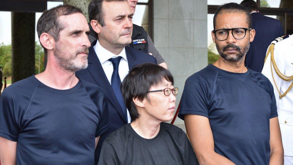 Patrick Picque, left, and Laurent Lassimouillas, right, and a South Korean hostage who has not been named