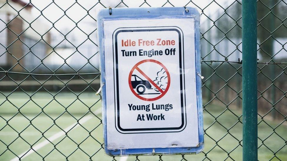 No vehicle idle idling emissions pollution "young lungs at play" sign outside school