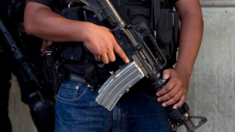 A police officer stands guard in Mexico's Guerrero state