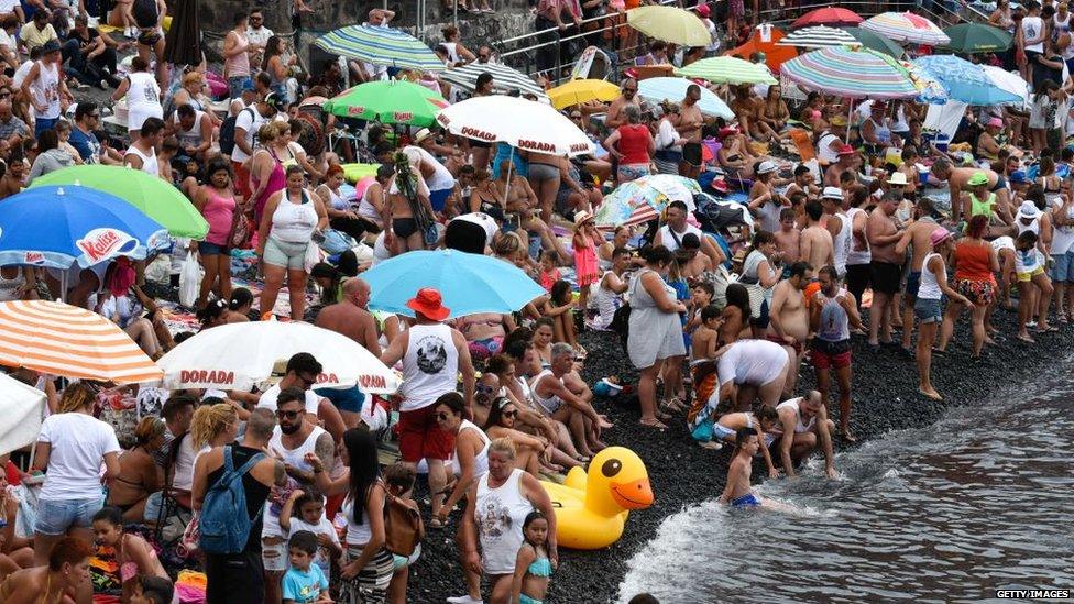 A crowded beach in Puerto de la Cruz